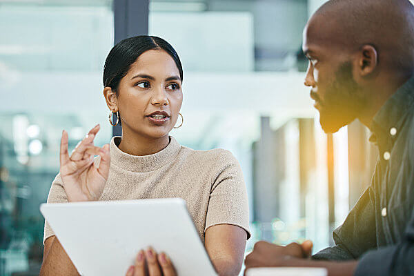2 business people discussing who to use as a cloud phone provider