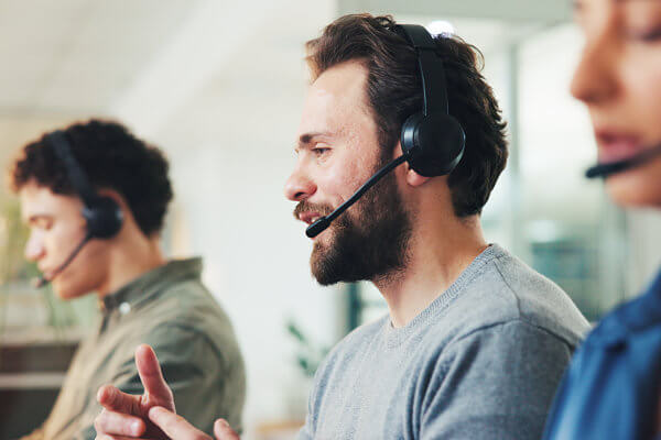 Contact center employees talking on their headsets