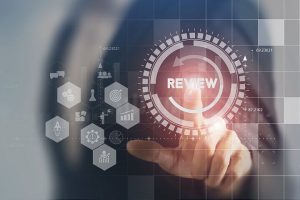 Business person touching a virtual graphic that says Recap for FluentStream's webinar 2025 recap