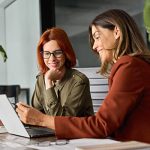 A women is reviewing how a Cloud Phone System will affect her client
