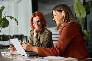 A women is reviewing how a Cloud Phone System will affect her client