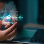 Person clicking on virtual graphic of voicemail to email for small business