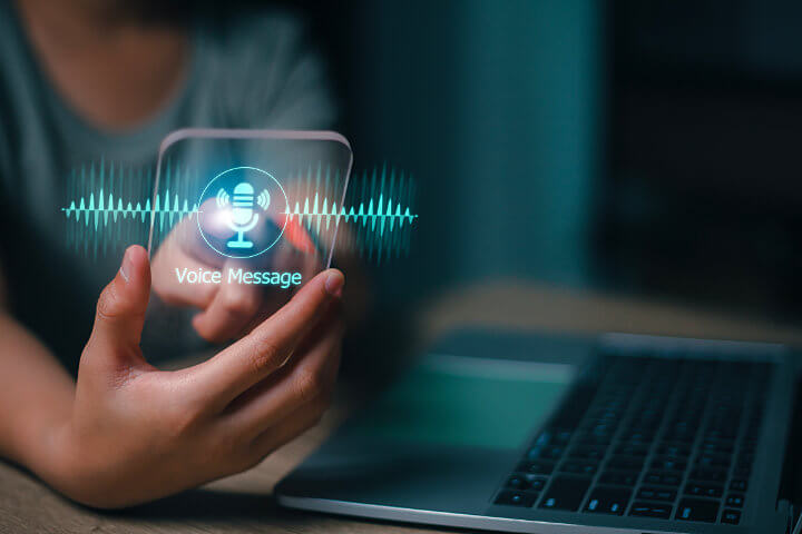 Person clicking on virtual graphic of voicemail to email for small business